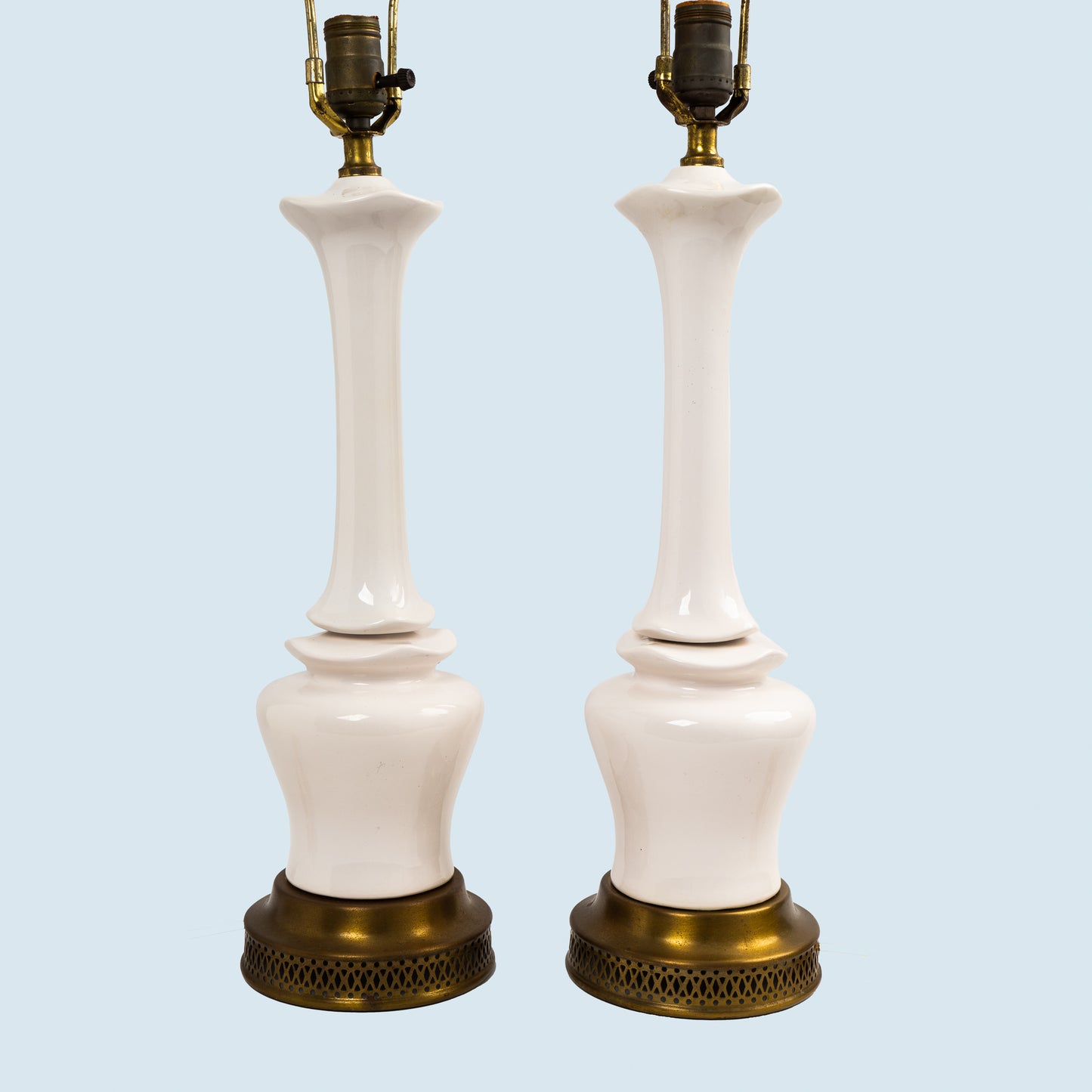 Pair of vintage mid-century off-white ceramic chinoiserie lamp bases with original harps and finials, circa 1950s–1960s.