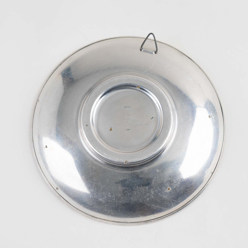 
                  
                    Vintage decorative plate made from iridescent purple and blue butterfly wings, mounted for wall display or table decor
                  
                