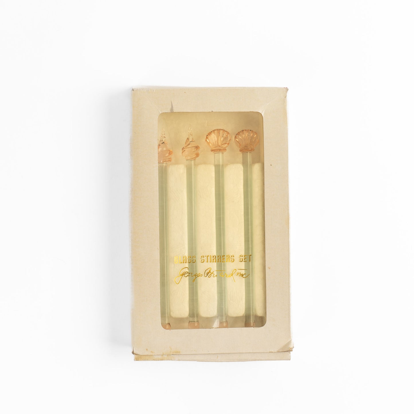 Set of four vintage glass drink stirrers with seashell designs in light pink and clear glass, designed by Georges Briard.