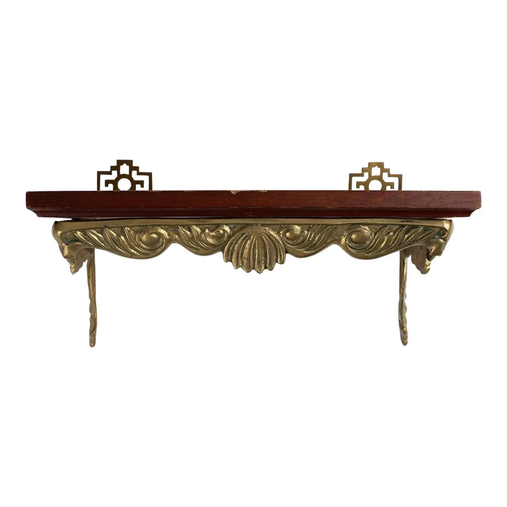Vintage mid-century modern wall shelf with cherry wood surface, brass supports, and raised edge for displaying art