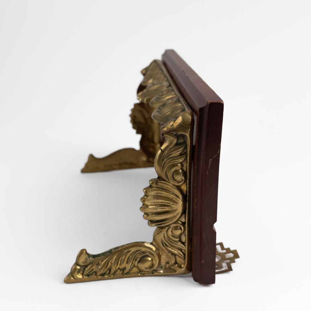 
                  
                    Vintage mid-century modern wall shelf with cherry wood surface, brass supports, and raised edge for displaying art

                  
                
