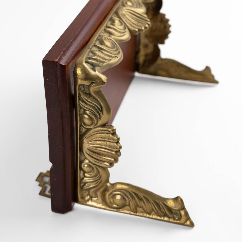
                  
                    Vintage mid-century modern wall shelf with cherry wood surface, brass supports, and raised edge for displaying art
                  
                