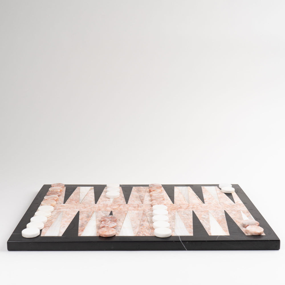 
                  
                    Vintage natural marble backgammon set featuring pink, white and black stone board with matching marble playing pieces
                  
                