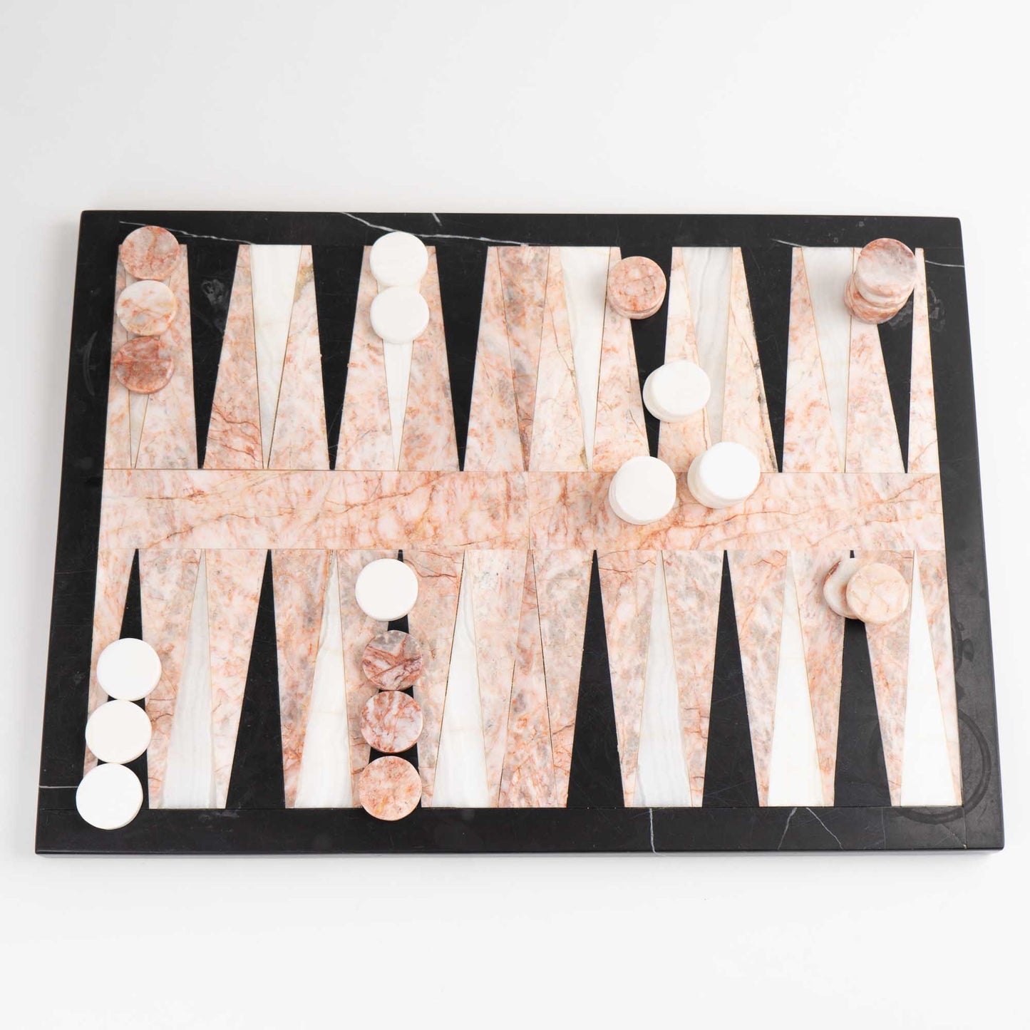 Vintage natural marble backgammon set featuring pink, white and black stone board with matching marble playing pieces