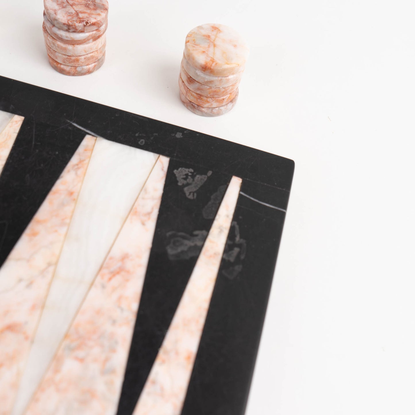 Vintage natural marble backgammon set featuring pink, white and black stone board with matching marble playing pieces