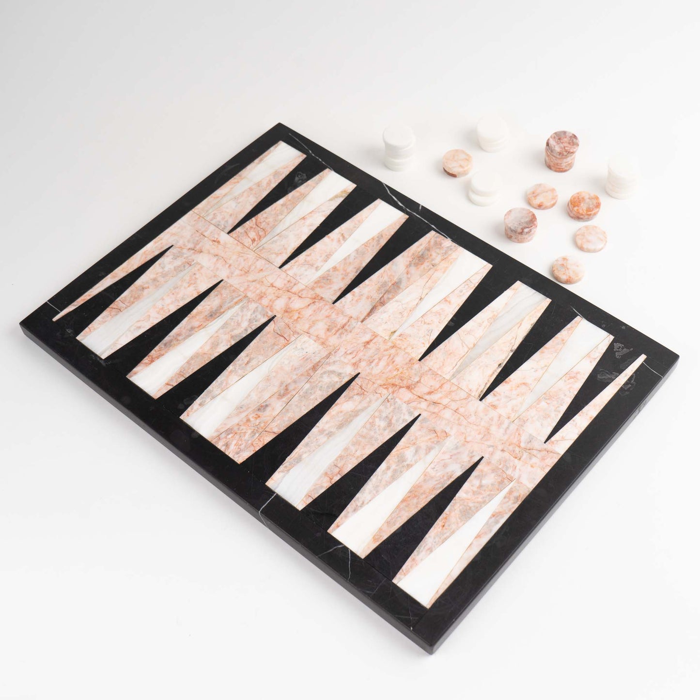 Vintage natural marble backgammon set featuring pink, white and black stone board with matching marble playing pieces
