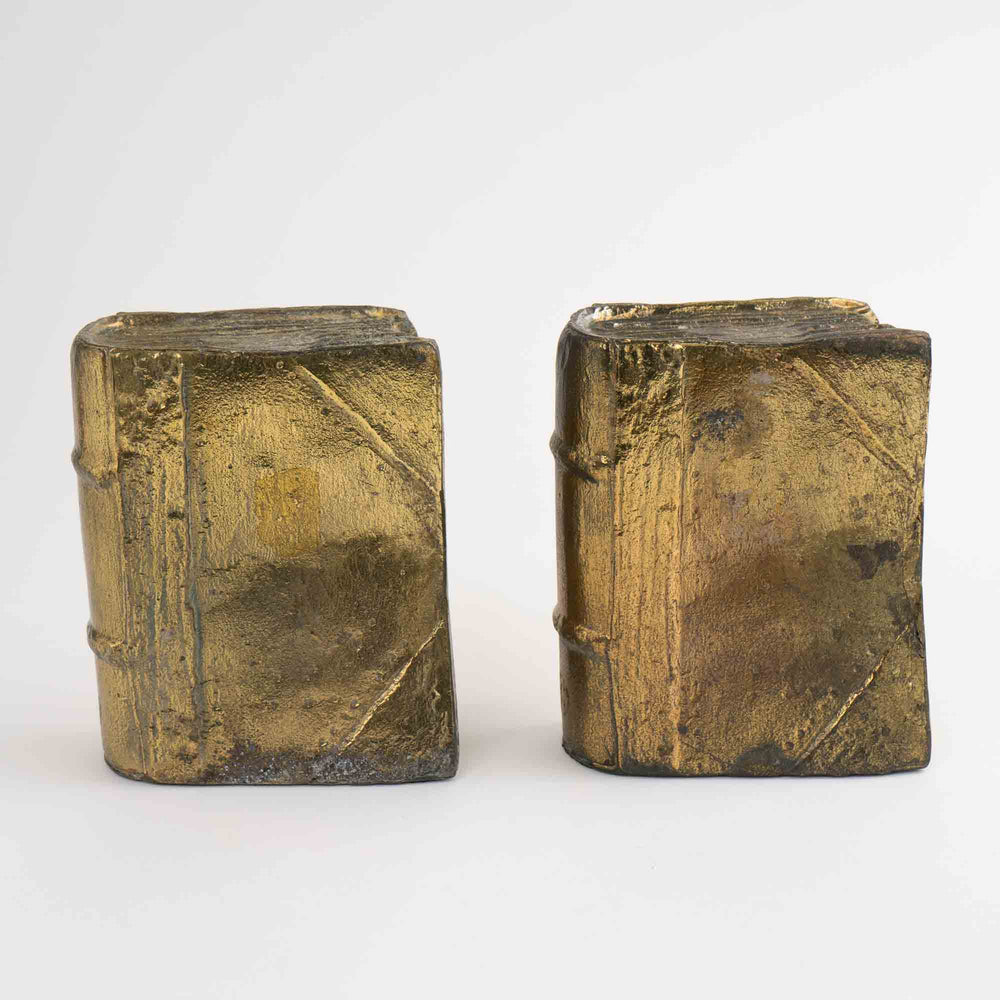 
                  
                    Pair of vintage brass bookends shaped like books
                  
                