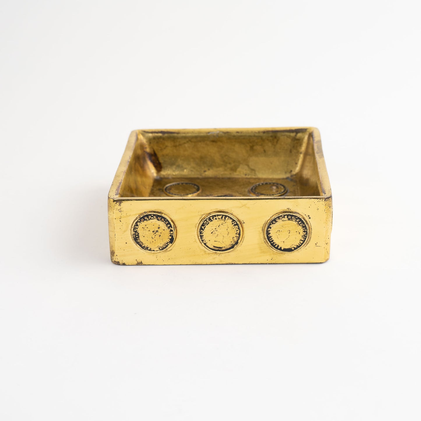 Vintage square brass ashtray featuring decorative historic Napoleon and Elizabeth coins, repurposed as jewelry catchall