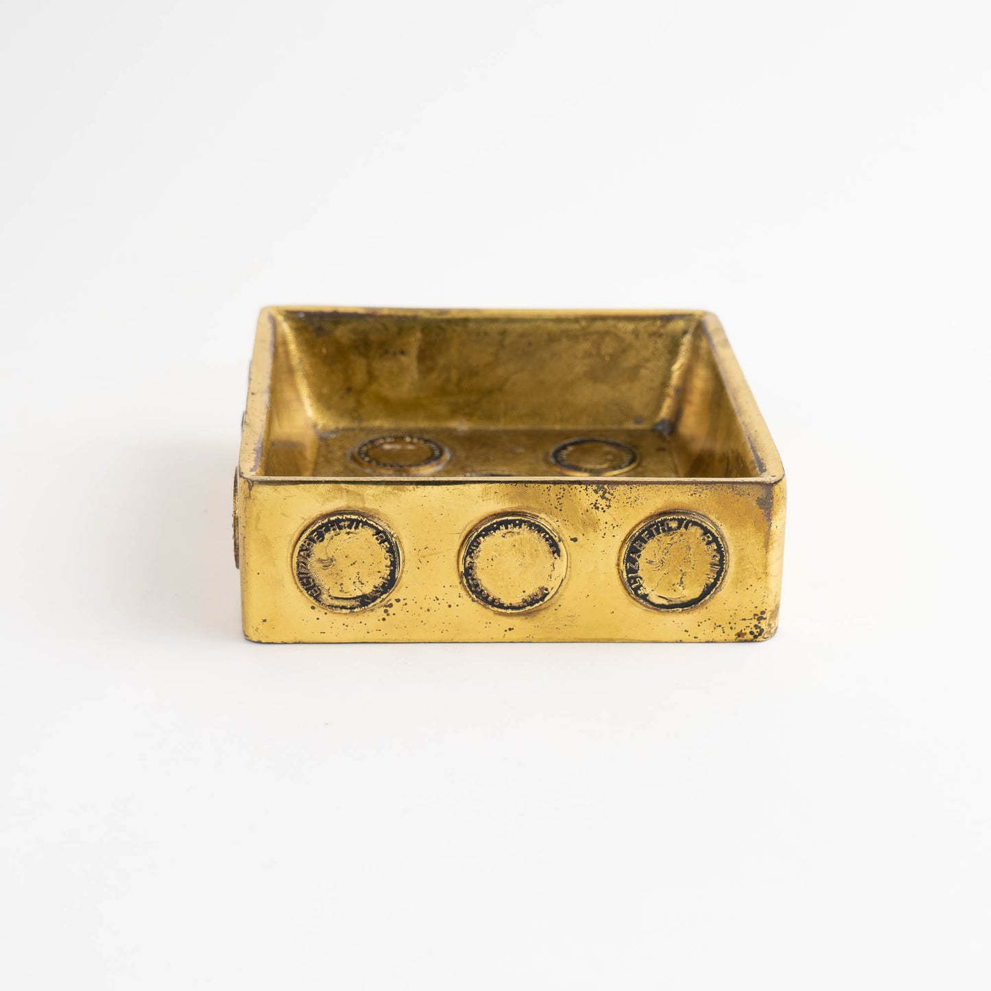 Mid-century square brass ashtray featuring decorative historic Napoleon and Elizabeth coins