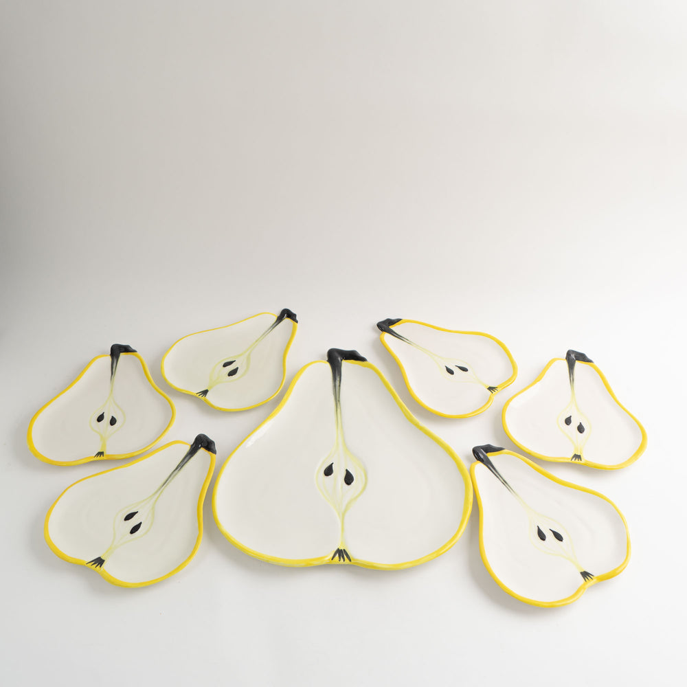 
                  
                    Set of seven vintage hand-painted pear-shaped ceramic plates designed by Ernestine Cannon and made in Salerno, Italy
                  
                