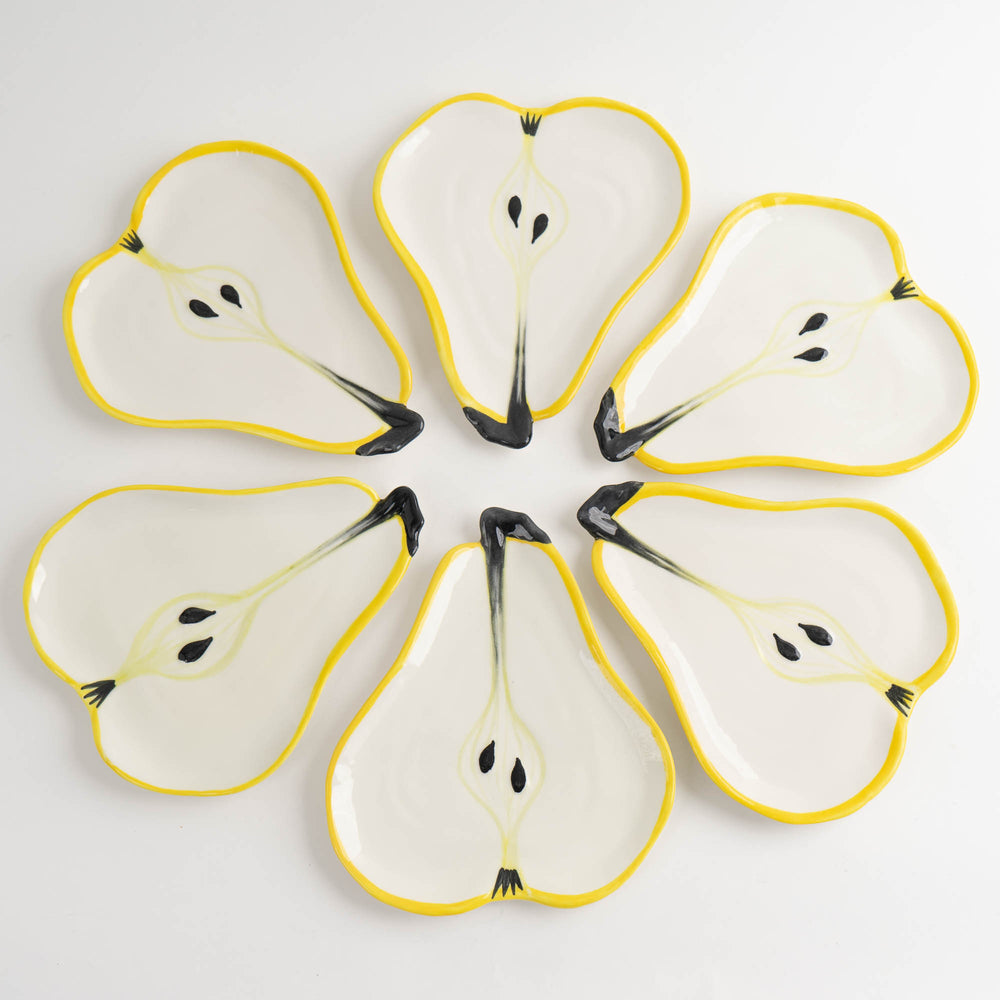 
                  
                    Set of seven vintage hand-painted pear-shaped ceramic plates designed by Ernestine Cannon and made in Salerno, Italy
                  
                