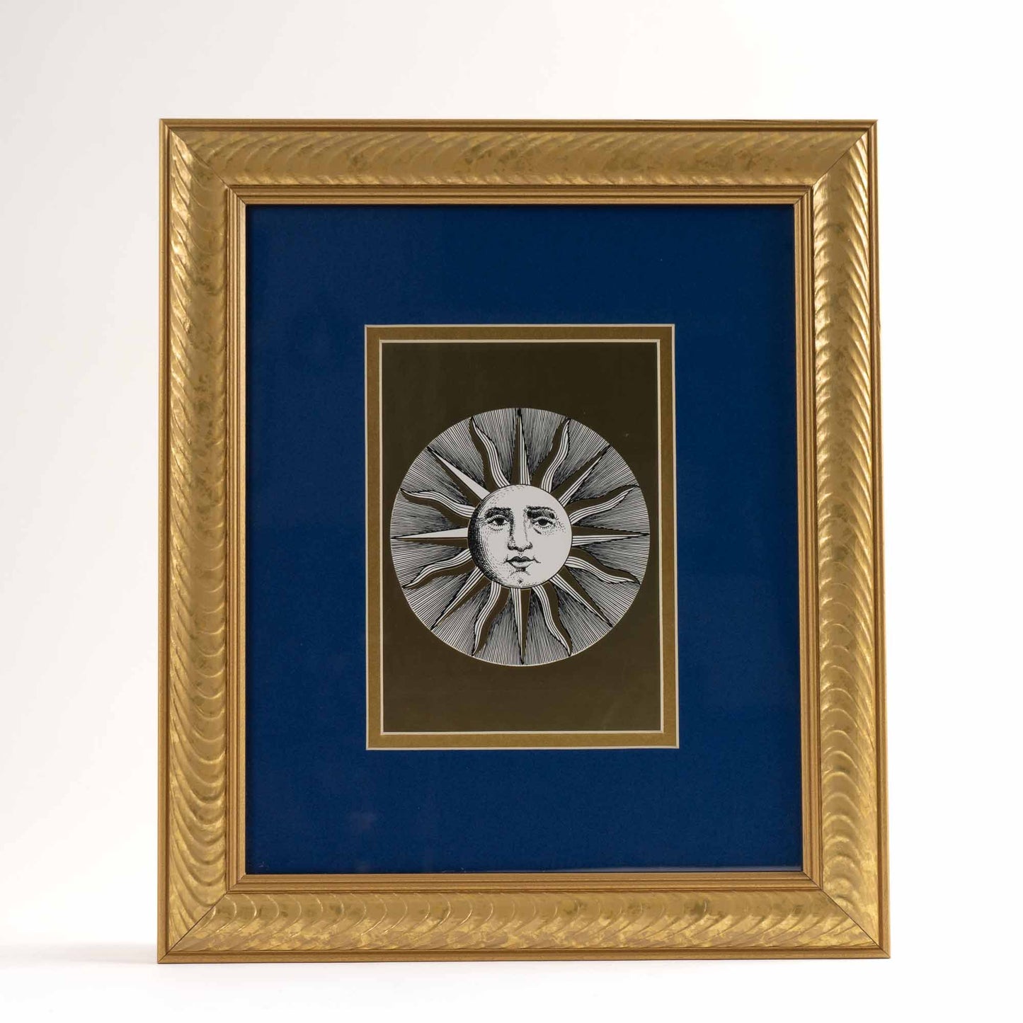 Pair of vintage Fornasetti Soli (sun) prints in gold frames with blue matting and metallic gold sun details