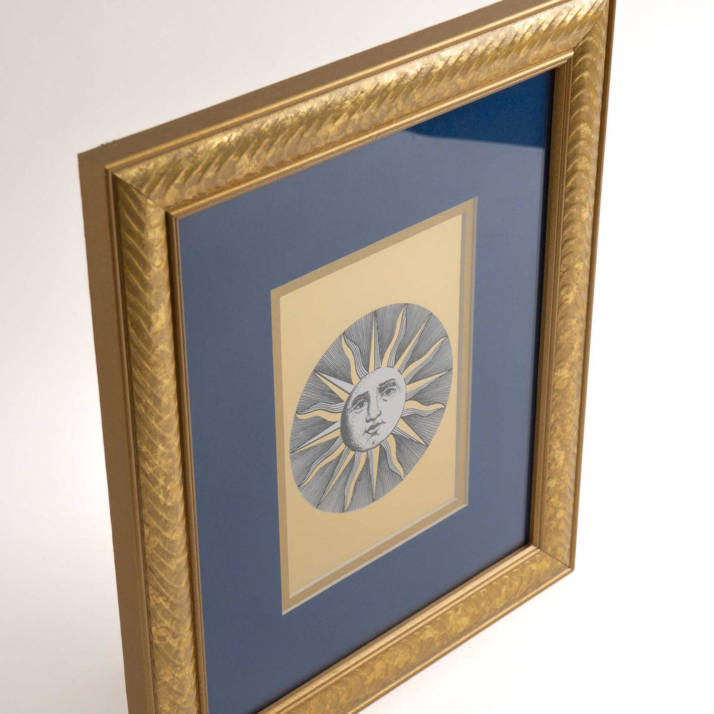 
                  
                    Pair of vintage Fornasetti Soli (sun) prints in gold frames with blue matting and metallic gold sun details
                  
                