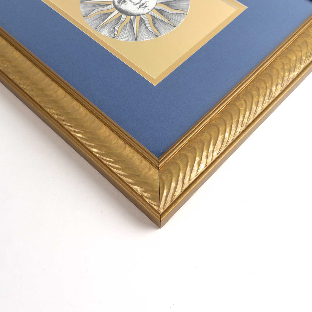 
                  
                    vintage Fornasetti Soli (sun) prints in gold frames with blue matting and metallic gold sun details
                  
                