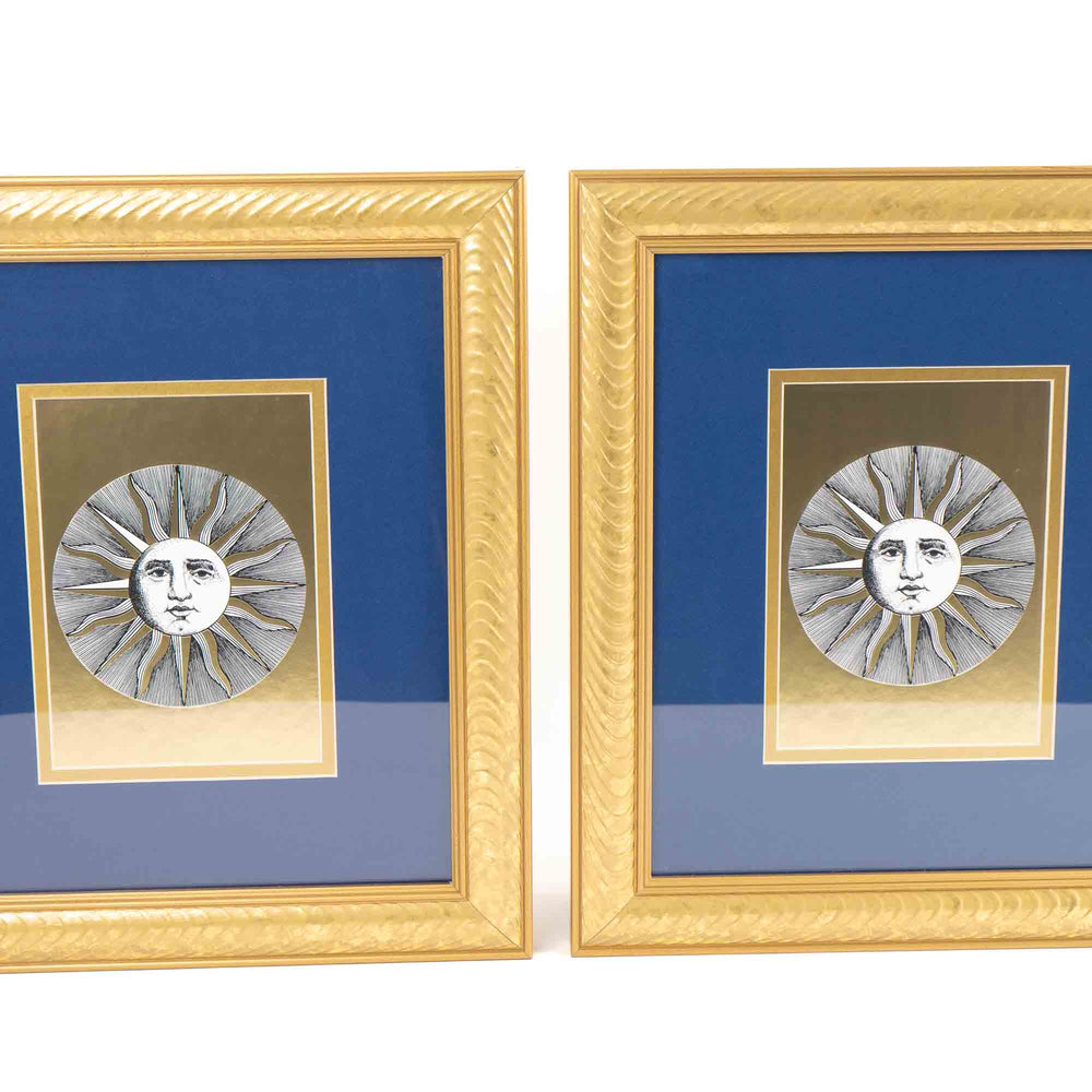 
                  
                    Pair of vintage Fornasetti Soli (sun) prints in gold frames with blue matting and metallic gold sun details
                  
                