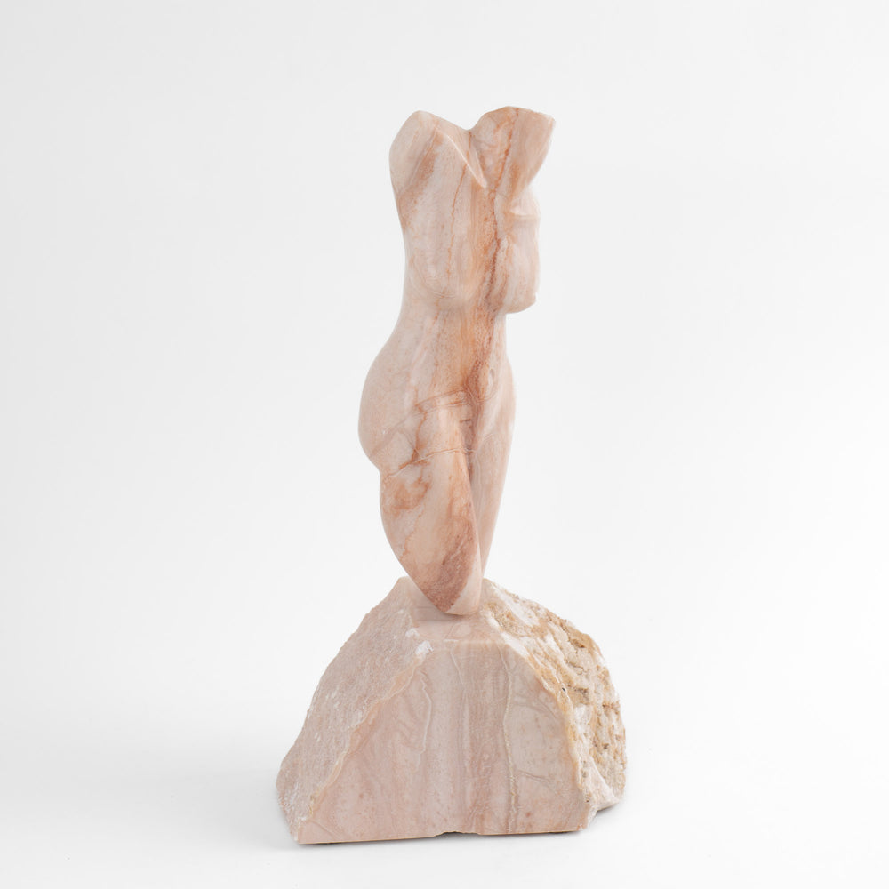 
                  
                    Hand-carved pink alabaster nude female torso sculpture by American artist Bryan Ross, signed, with base, 20th century.
                  
                