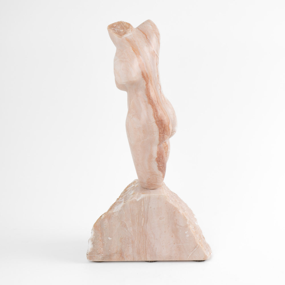 
                  
                    Hand-carved pink alabaster nude female torso sculpture by American artist Bryan Ross, signed, with base, 20th century.
                  
                