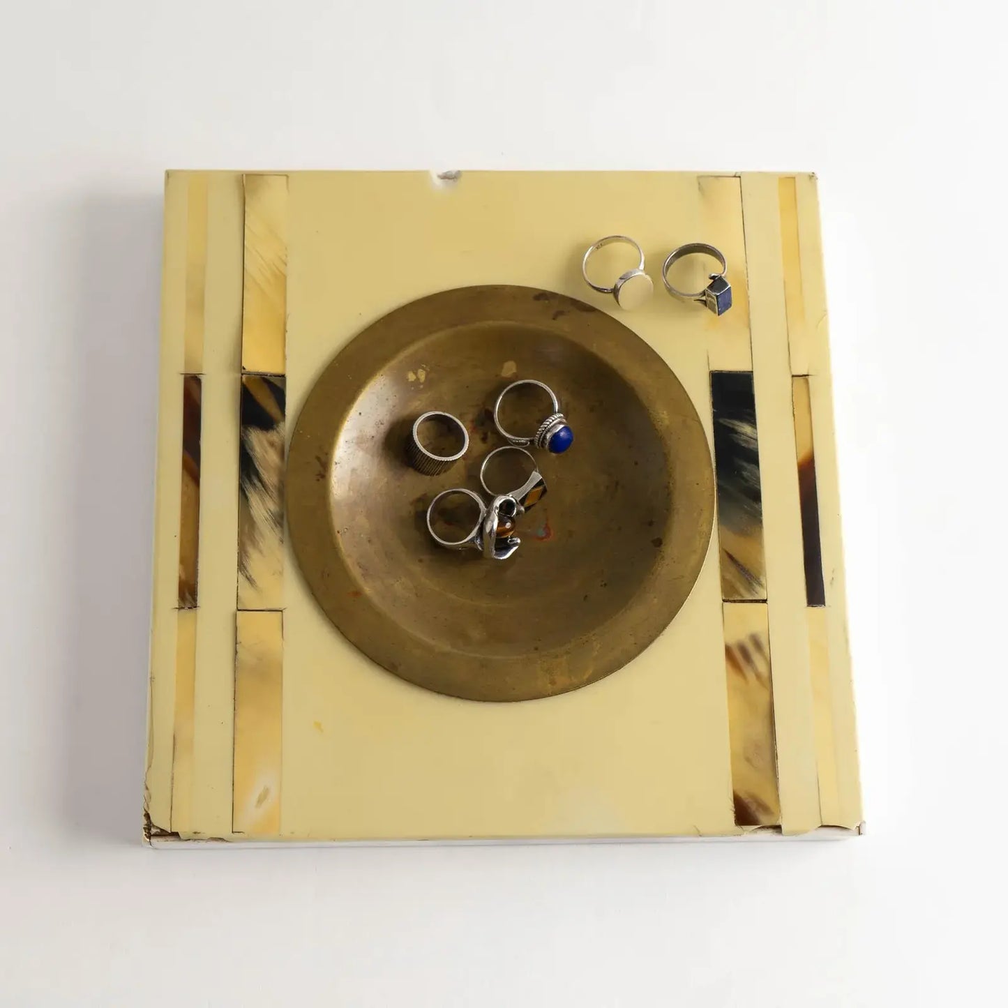 Vintage square horn inlay catchall with round brass ashtray center, top view shown holding vintage jewelry