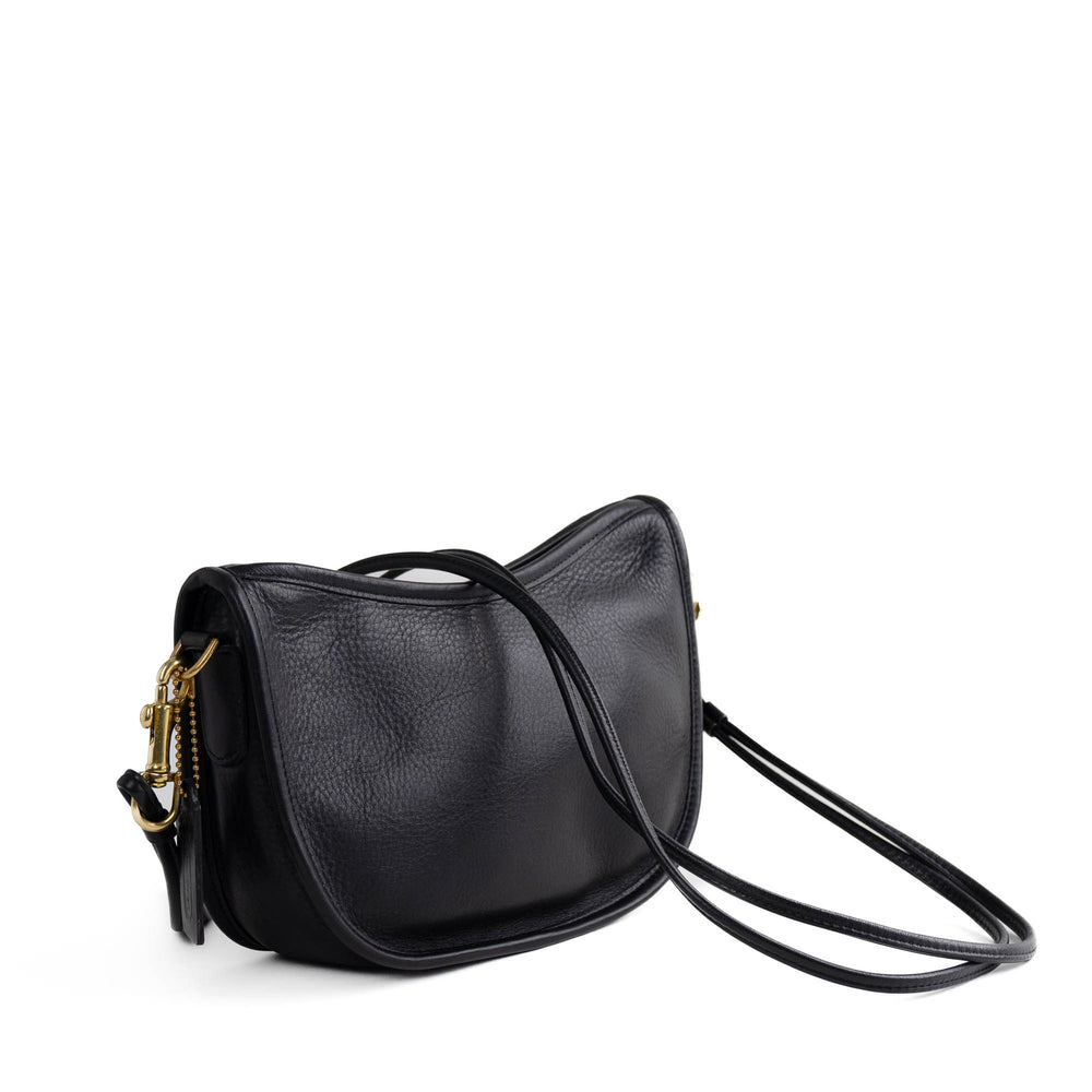 
                  
                    Vintage black leather Coach Swinger 4080 crescent bag with brass hardware from 1988 holiday collection
                  
                