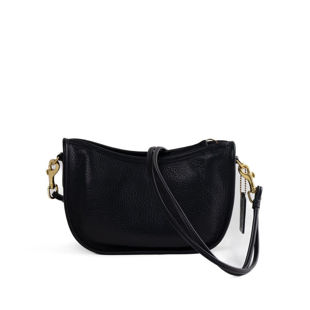 
                  
                    Vintage black leather Coach Swinger 4080 crescent bag with brass hardware from 1988 holiday collection
                  
                