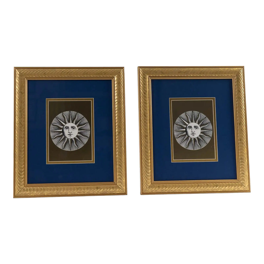Pair of vintage Fornasetti Soli (sun) prints in gold frames with blue matting and metallic gold sun details