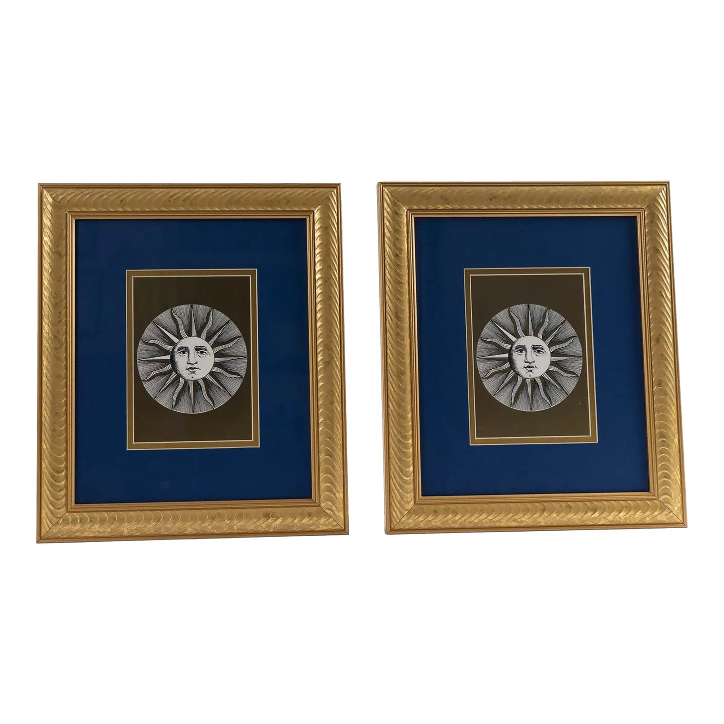 Pair of vintage Fornasetti Soli (sun) prints in gold frames with blue matting and metallic gold sun details
