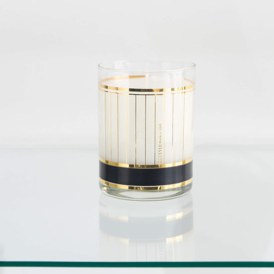 Load image into Gallery viewer, Vintage Black and Gold Stripe Culver Glass Candle on vintage bar glass shelf
