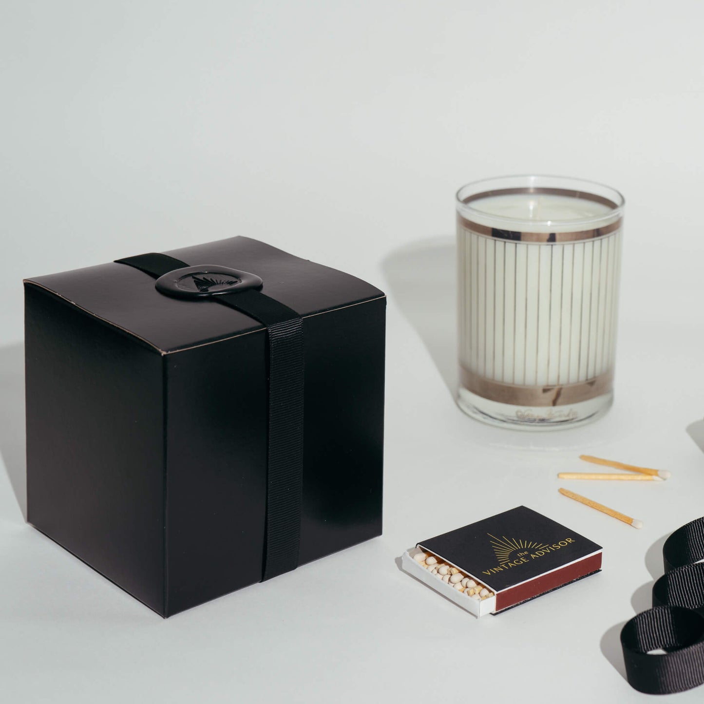 Load image into Gallery viewer, Georges Briard Old Fashioned Cocktail Glass candle in black gift box with ribbon and wax seal
