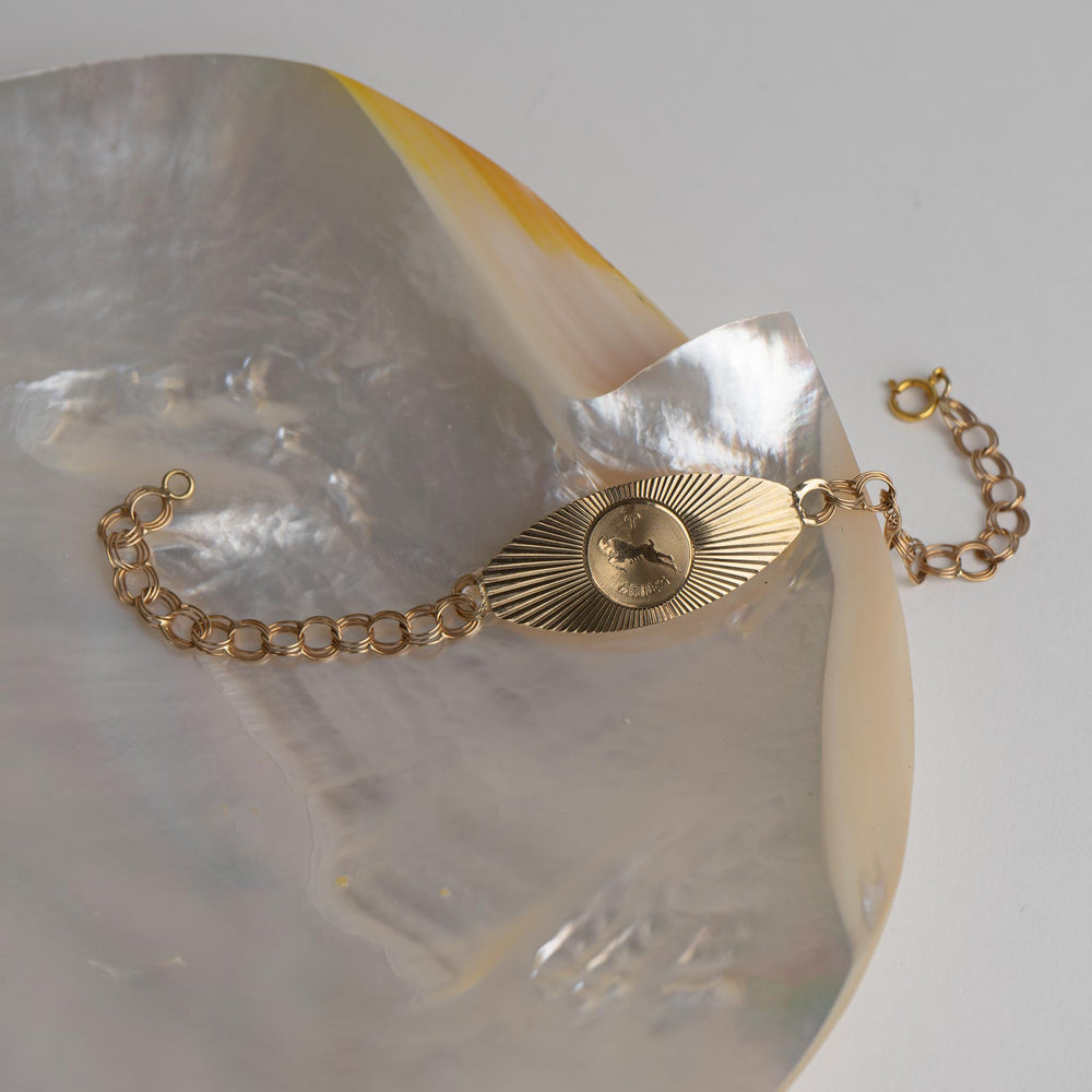 
                  
                    zodiac aries 14k gold medallion bracelet 
                  
                