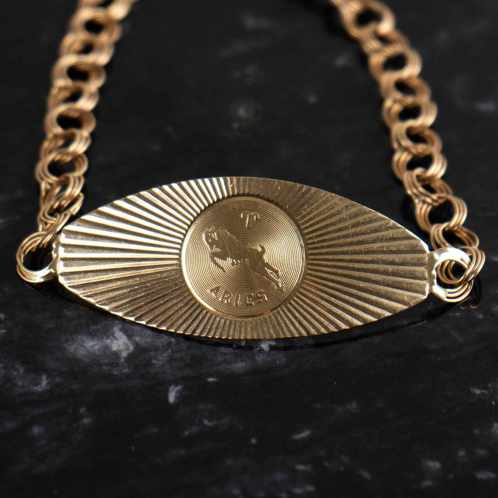 
                  
                    zodiac aries 14k gold medallion bracelet 
                  
                