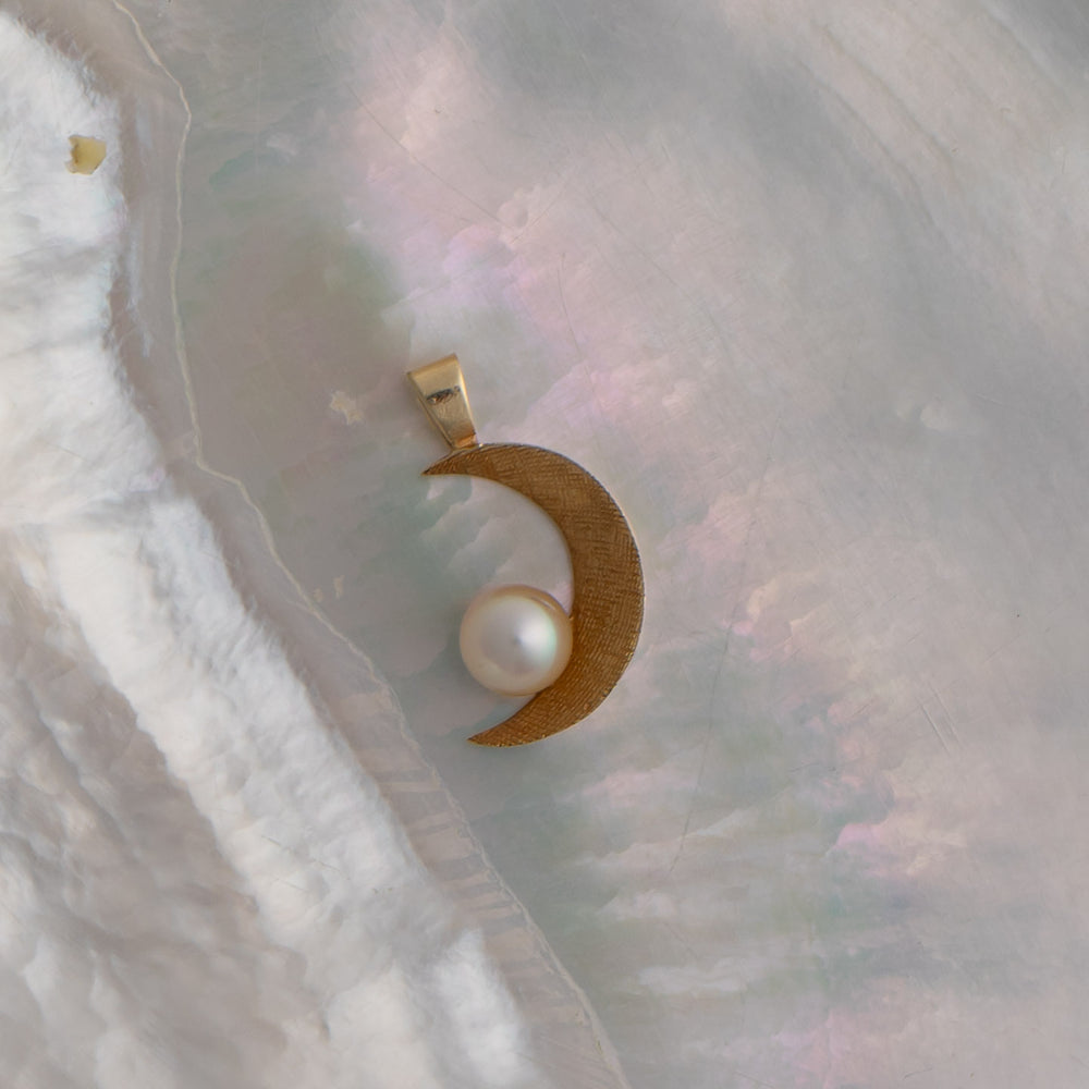 
                  
                    vintage 14k gold crescent moon charm with round pearl accent
                  
                