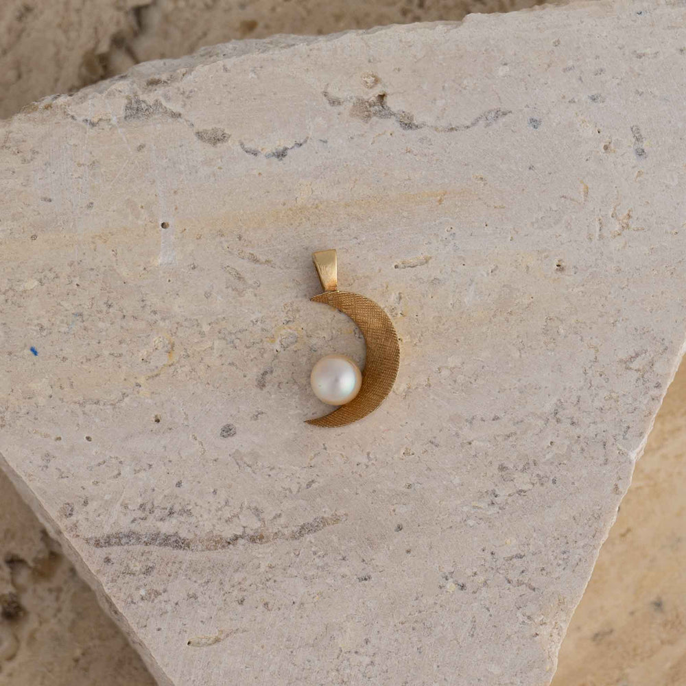 
                  
                    vintage 14k gold crescent moon charm with round pearl accent
                  
                