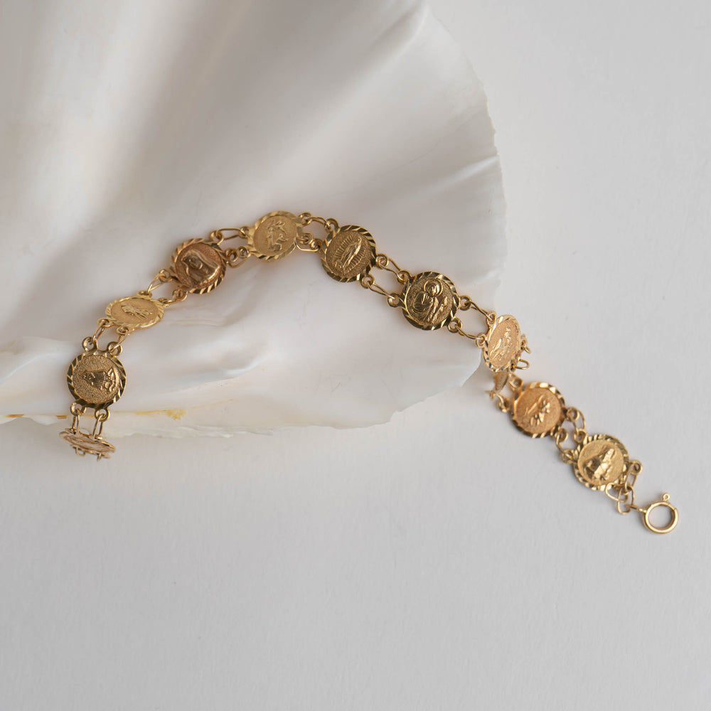 
                  
                     vintage 14k gold catholic saints medallion bracelet

                  
                