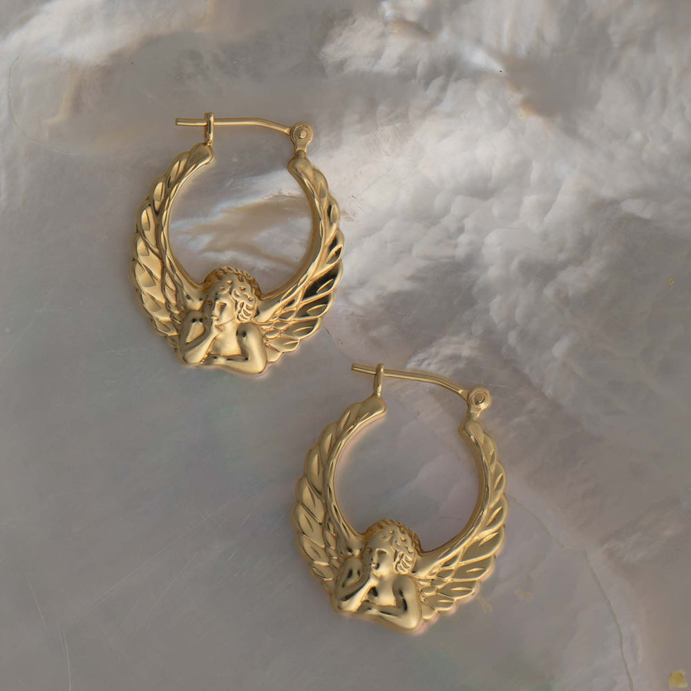
                  
                    vintage 14k gold fiorucci style angel hoop earrings
                  
                