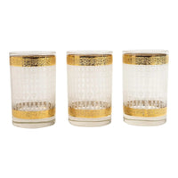 Set of three vintage clear glass highball cocktail glasses with frosted basket weave texture in center section and decorative gold bands near rim and base