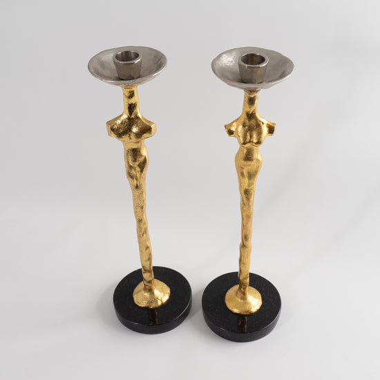 Gold female and male candle holders love magic