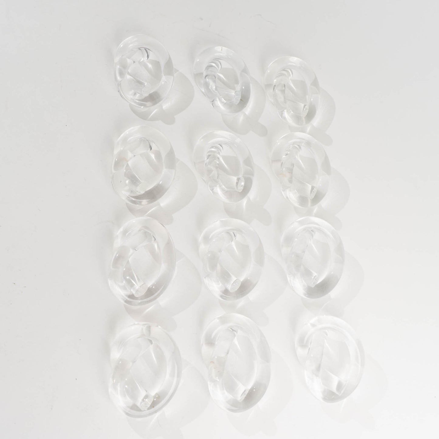 Load image into Gallery viewer, Mid-Century Lucite Pretzel Twist Napkin Rings by Dorothy Thorpe - Set of 10
