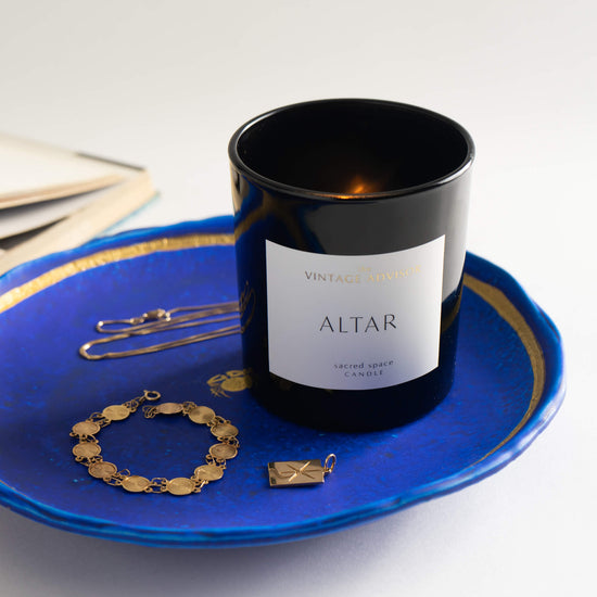 Altar candle burning - blue and gold jewelry holder 